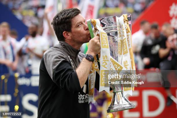 Darrell Clarke, Manager of Port Vale celebrates with the Sky Bet League Two Trophy after their sides victory in the Sky Bet League Two Play-off Final...