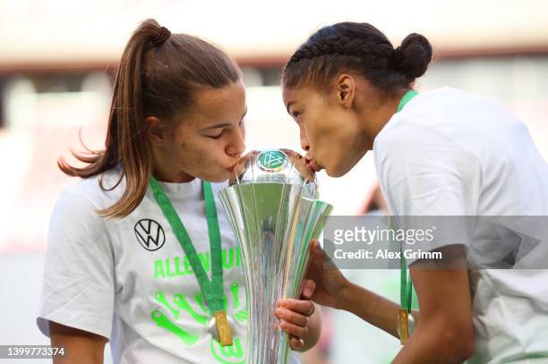 Lena Oberdorf and Sveindis Jonsdottir of VfL Wolfsburg celebrate with the DFB-Pokal Frauen trophy after their sides victory during the Women's DFB...