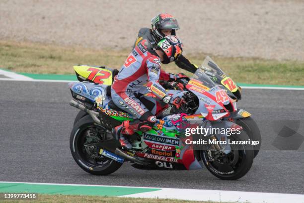 Fabio Di Giannantonio of Italy and Gresini Racing MotoGP congratulates with Marco Bezzecchi of Italy and Mooney VR46 Racing Team during the MotoGP of...