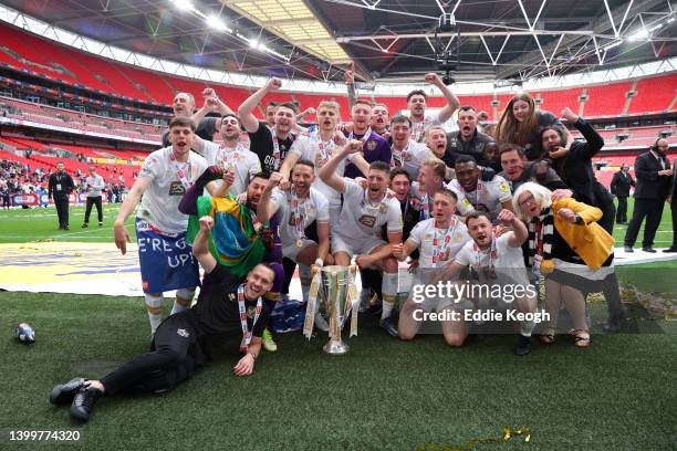 Players and staff of Port Vale celebrate with the Sky Bet League Two Play Off Trophy following their sides victory in the Sky Bet League Two Play-off...