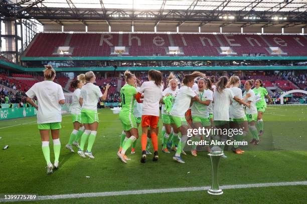 VfL Wolfsburg players celebrate with the DFB-Pokal Frauen trophy after their sides victory during the Women's DFB Cup final match between VfL...