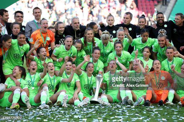 VfL Wolfsburg players celebrate with the DFB-Pokal Frauen trophy after their sides victory during the Women's DFB Cup final match between VfL...
