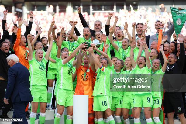 Alexandra Popp, Almuth Schult and Svenja Huth of VfL Wolfsburg lift the DFB-Pokal Frauen trophy after their sides victory during the Women's DFB Cup...