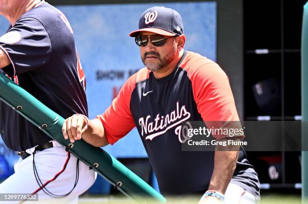 Manager Dave Martinez of the Washington Nationals watches the game in the third inning against the Colorado Rockies during game one of a doubleheader...