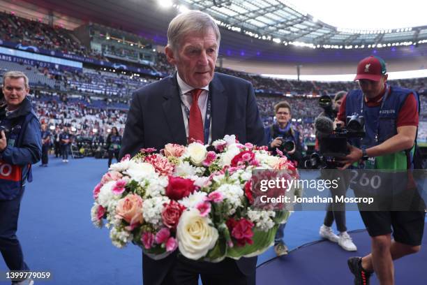 Kenny Dalglish takes a bouquet of flowers to lay in front of the Liverpool fans to mark the anniversary of the Heysel Stadium disaster in 1985 during...