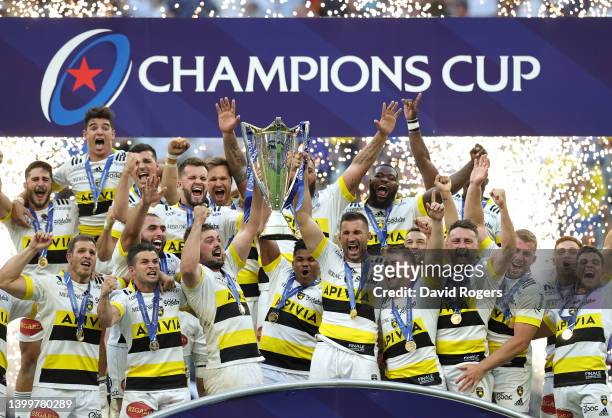 Gregory Alldritt and Romain Sazy of La Rochelle lift the Heineken Champions Cup as their side celebrates after the final whistle following their...