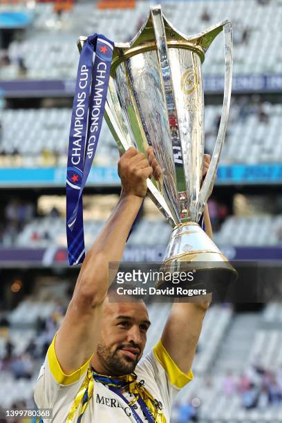 Dillyn Leyds of La Rochelle lifts the Heineken Champions Cup as their side celebrate after the final whistle following victory in the Heineken...