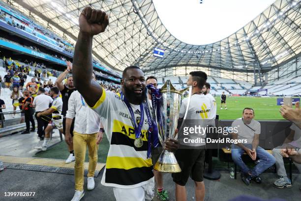 Dany Priso of La Rochelle carries the Heineken Champions Cup as their side celebrate after the final whistle following victory in the Heineken...