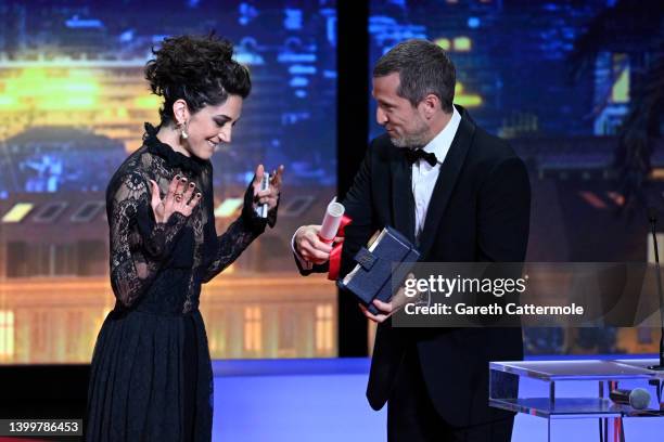 Zahra Amir Ebrahimi receives from Guillaume Canet the Best Actress Palme d'Or Award for the movie 'Holy Spider' during the closing ceremony for the...