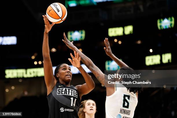 Jantel Lavender of the Seattle Storm shoots against Natasha Howard of the New York Liberty during the third quarter at Climate Pledge Arena on May...