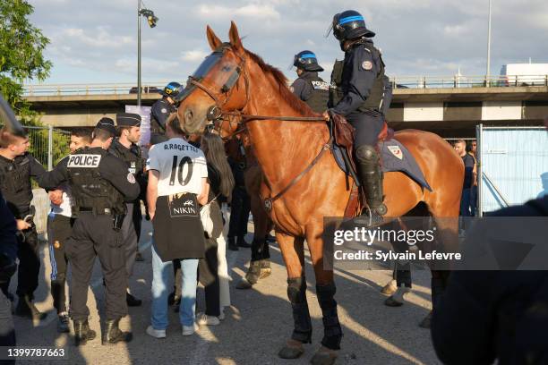 Riot police on horses check Spanish fans who gather near Stade de France prior the UEFA Champions League Final Between Liverpool and Real Madrid on...