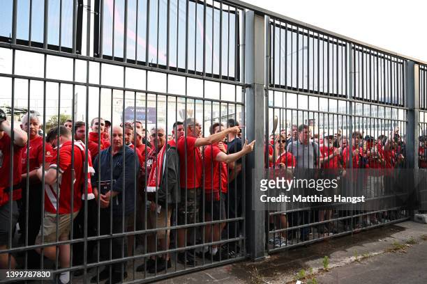 Liverpool fans react as they queue outside the stadium prior to the UEFA Champions League final match between Liverpool FC and Real Madrid at Stade...