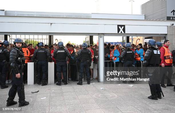 Liverpool fans are seen queuing outside the stadium prior to the UEFA Champions League final match between Liverpool FC and Real Madrid at Stade de...