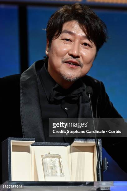 Song Kang-Ho receives the Best Actor Palme d'Or Award for the movie 'Broker' during the closing ceremony for the 75th annual Cannes film festival at...