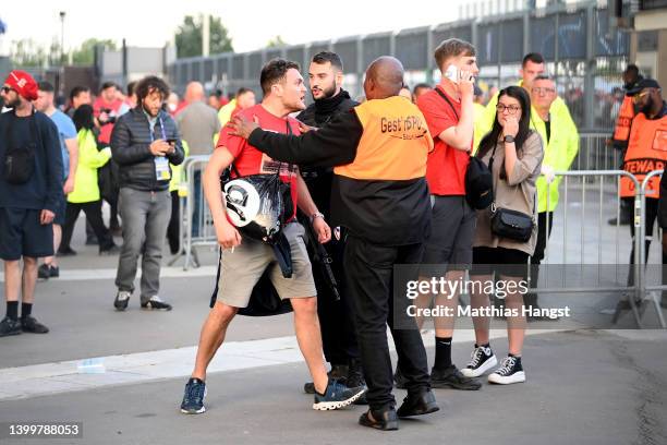 Liverpool fans are seen queuing outside the stadium prior to the UEFA Champions League final match between Liverpool FC and Real Madrid at Stade de...