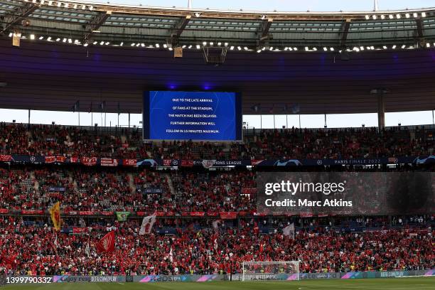 Message about the delayed kick off is displayed above a partially filled Liverpool section prior to the UEFA Champions League final match between...