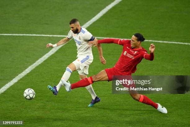 Karim Benzema of Real Madrid is challenged by Virgil van Dijk of Liverpool during the UEFA Champions League final match between Liverpool FC and Real...