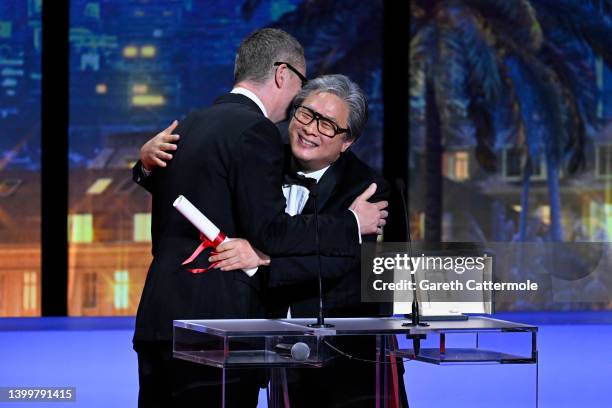 Director Park Chan-wook receives, from Director Nicolas Winding Refn , the Best Director Palme d'Or Award for the movie 'Heojil Kyolshim' during the...