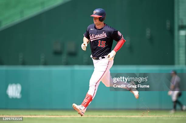 Riley Adams of the Washington Nationals rounds the bases after hitting a two-run home run in the eighth inning against the Colorado Rockies during...