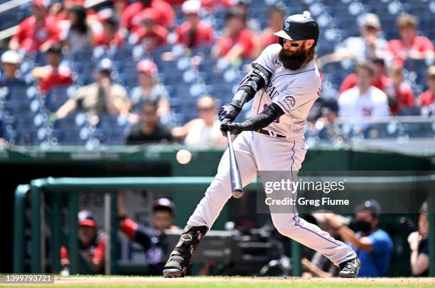 Charlie Blackmon of the Colorado Rockies hits a single in the first inning against the Washington Nationals during game one of a doubleheader at...