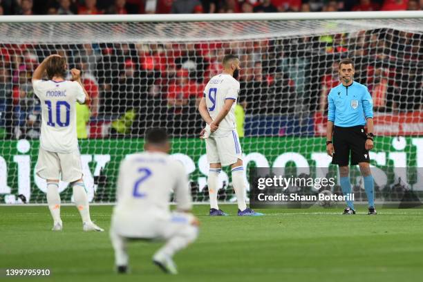 Karim Benzema of Real Madrid reacts after their goal is ruled offside by VAR during the UEFA Champions League final match between Liverpool FC and...