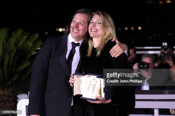 Director Felix Van Groeningen and Charlotte Vandermeersch pose with the Jury Prize for the movie 'Le Otto Montagne' during the winner photocall...