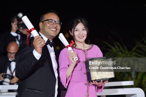 Film Writer Abinash Bikram Shah and Jianying Chen pose with the Best Short Film Palme d'Or Award for 'Hai Bian Sheng Qi Yi Zuo Xuan Ya' during the...