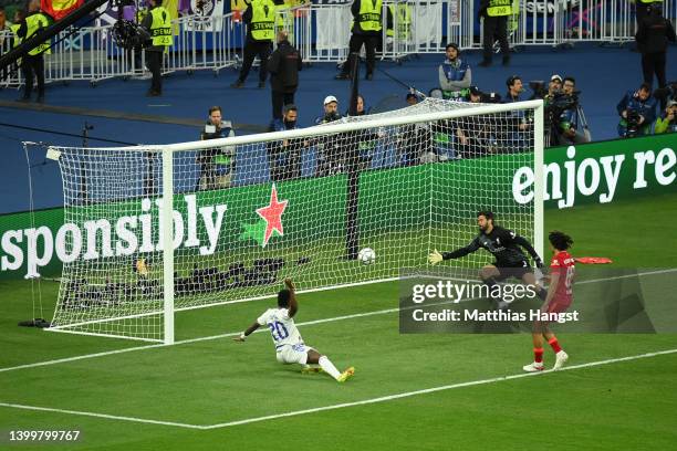 Vinicius Junior of Real Madrid scores their team's first goal during the UEFA Champions League final match between Liverpool FC and Real Madrid at...