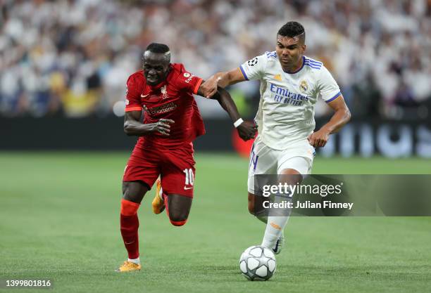 Sadio Mane of Liverpool is challenged by Casemiro of Real Madrid during the UEFA Champions League final match between Liverpool FC and Real Madrid at...