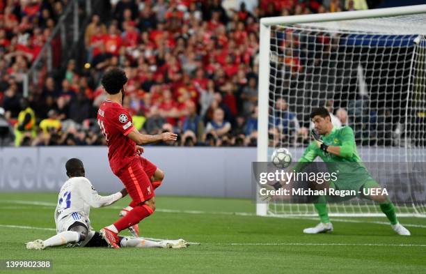 Mohamed Salah of Liverpool has a shot saved by Thibaut Courtois of Real Madrid during the UEFA Champions League final match between Liverpool FC and...