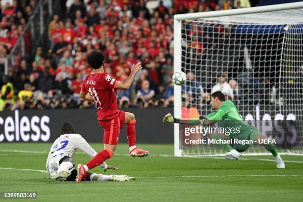 Mohamed Salah of Liverpool has a shot saved by Thibaut Courtois of Real Madrid during the UEFA Champions League final match between Liverpool FC and...