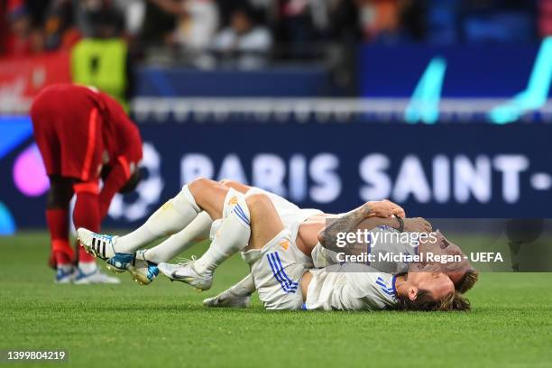 Luka Modric of Real Madrid embraces Toni Kroos after the final whistle is blown to confirm their side as winners of the UEFA Champions League...