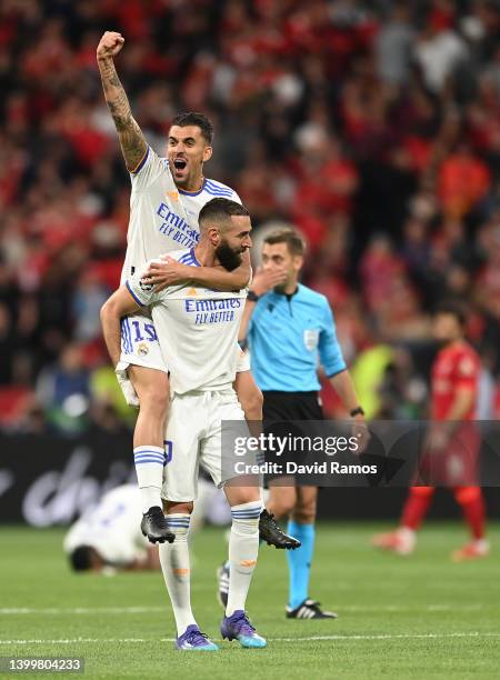 Karim Benzema and Dani Ceballos of Real Madrid celebrate following their sides victory in the UEFA Champions League final match between Liverpool FC...