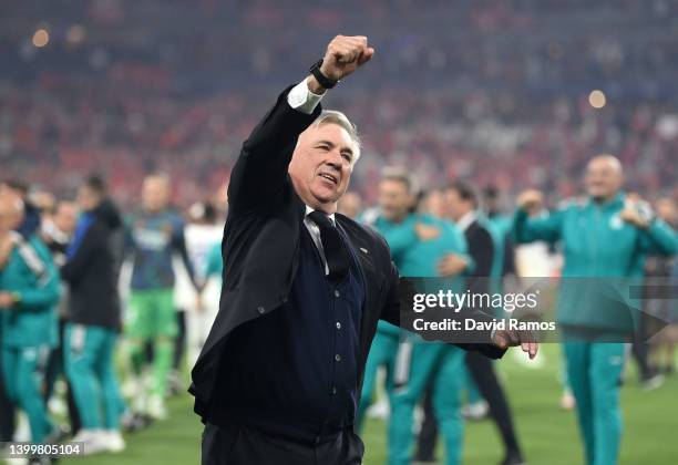 Carlo Ancelotti, Head Coach of Real Madrid celebrates with the fans after their sides victory during the UEFA Champions League final match between...