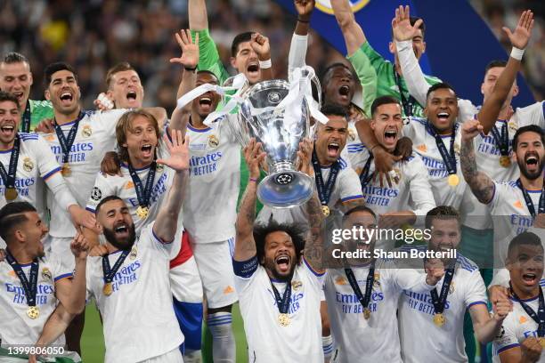 Marcelo of Real Madrid lifts the UEFA Champions League trophy after their sides victory during the UEFA Champions League final match between...