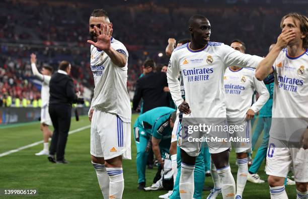 Karim Benzema of Real Madrid signals his five Champions League victories, as Ferland Mendy and Luka Modric also celebrate winning the UEFA Champions...