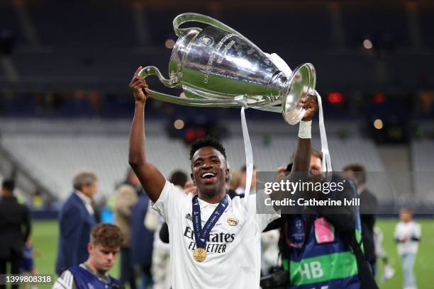 Vinicius Junior of Real Madrid celebrates with the UEFA Champions League Trophy after their sides victory in the UEFA Champions League final match...