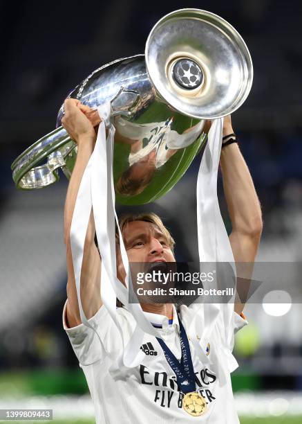Luka Modric of Real Madrid celebrates with the UEFA Champions League Trophy after their sides victory in the UEFA Champions League final match...