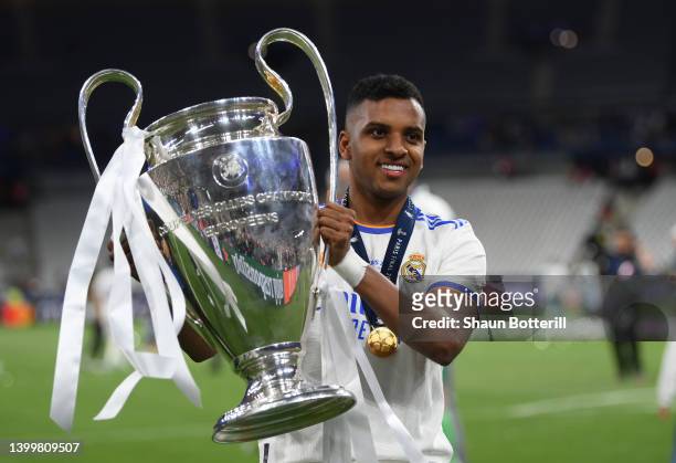 Rodrygo of Real Madrid celebrates with the UEFA Champions League Trophy after their sides victory in the UEFA Champions League final match between...