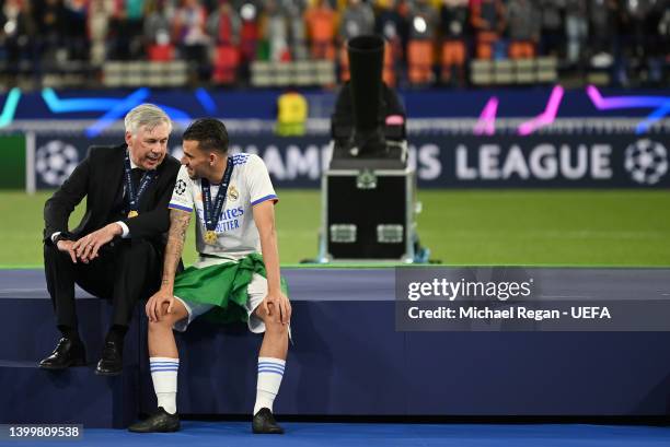 Carlo Ancelotti, Head Coach of Real Madrid interacts with Dani Ceballos of Real Madrid following their sides victory in the UEFA Champions League...