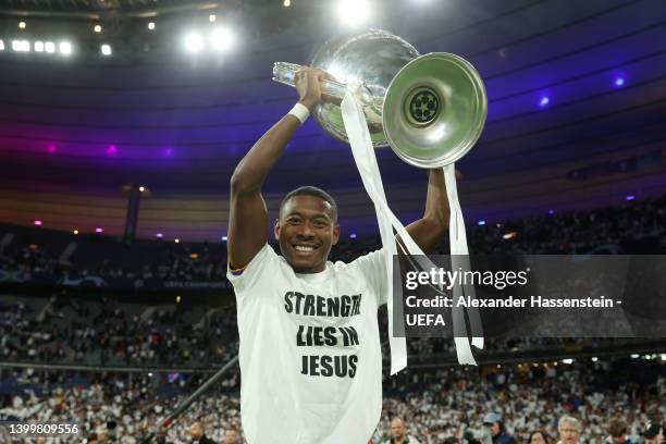 David Alaba of Real Madrid celebrates with the UEFA Champions League trophy after their sides victory during the UEFA Champions League final match...