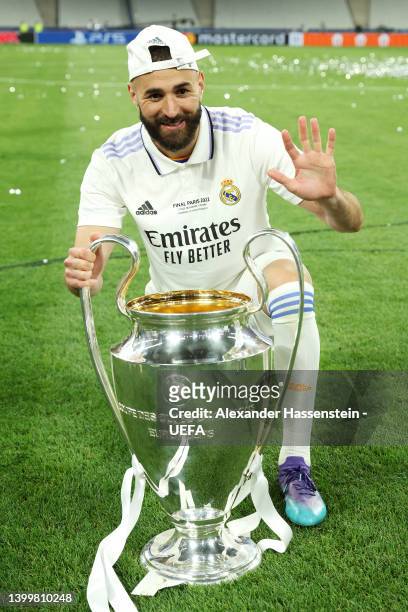 Karim Benzema of Real Madrid celebrates with the UEFA Champions League trophy after their sides victory during the UEFA Champions League final match...