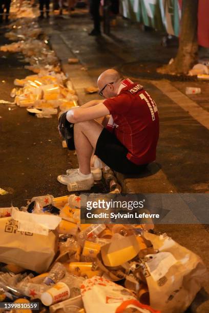 English fans react in the Paris' Fan Zone at the end of UEFA Champions League Final Between Liverpool and Real Madrid on May 28, 2022 in Paris,...