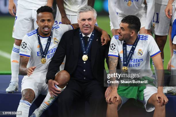 Carlo Ancelotti, Head Coach of Real Madrid interacts with Eder Militao and Dani Ceballos of Real Madrid following their sides victory in the UEFA...