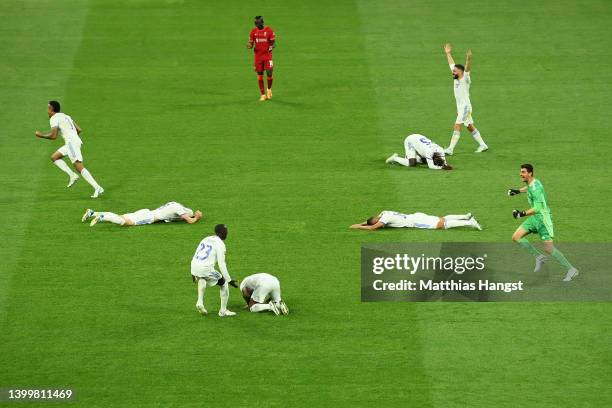 Players of Real Madrid celebrate as the final whistle is blown to confirm them as Winners of the UEFA Champions League following victory in the UEFA...