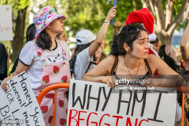 Aaliyah Pozo protests against the National Rifle Association annual convention at the George R. Brown Convention Center on May 28, 2022 in Houston,...