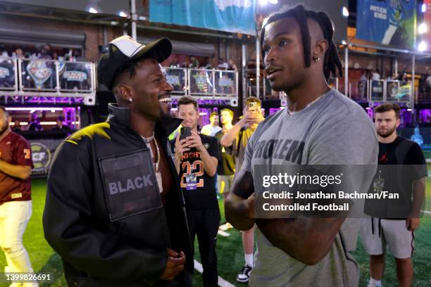 Antonio Brown and Julio Jones talk during Fan Controlled Football Season v2.0 - Week Seven on May 28, 2022 in Atlanta, Georgia.