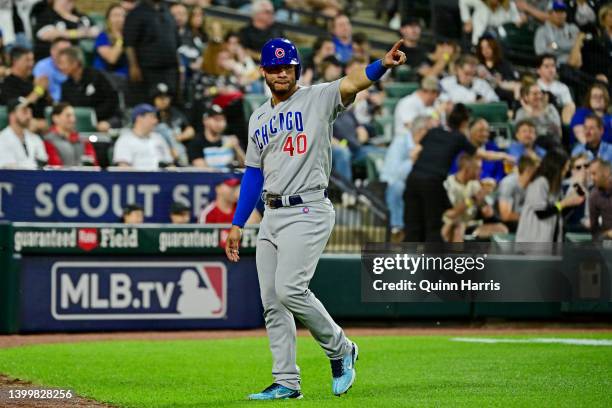 Willson Contreras of the Chicago Cubs points towards first base after scoring in the seventh inning against the Chicago White Sox at Guaranteed Rate...