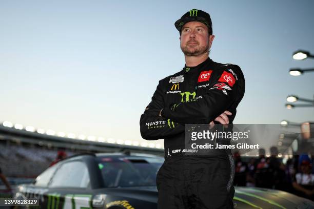 Kurt Busch, driver of the Monster Energy Toyota, looks on from the grid during practice for the NASCAR Cup Series Coca-Cola 600 at Charlotte Motor...