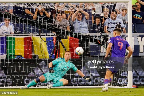 Lucas Cavallini of Vancouver Whitecaps scores against Tim Melia of Sporting Kansas City off a penalty kick during the first half at Children's Mercy...